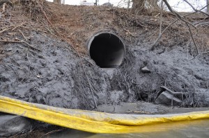 Coal ash spills from a stormwater pipe into the Dan River. 